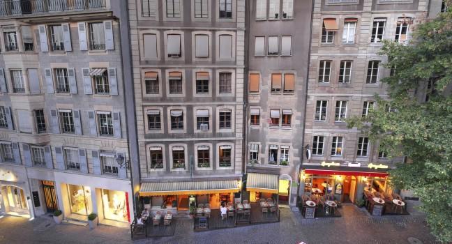 High-angle view of some old and charming houses on Rue de la Fontaine in the old town of Geneva, Switzerland. 