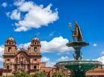 Church and Incan fountain in the Plaza de Armas of Cusco, Peru