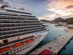 PHILIPSBURG, ST. MAARTEN - JAN.16, 2013: Cruise ship anchored in the popular tropical island of St. Maarten at sunset.  The Wathey Cruise Pier was recently dredged to accommodate larger cruise ships.