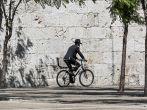 JERUSALEM, ISRAEL - MAY 26: Hassid rides a bicycle past the Jaffa Gate. The Western Wall is the most sacred sites in Judaism, it attracts thousands of devotees every day, on May 26, 2013 in Jerusalem; Shutterstock ID 142560175; Project/Title: Israel ebook