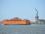 NEW YORK CITY, USA - May 26, 2014: Staten Island Ferry passing the Statue of Liberty in  New York Harbor. ; Shutterstock ID 195164825; Project/Title: 25; Downloader: Fodors Travel